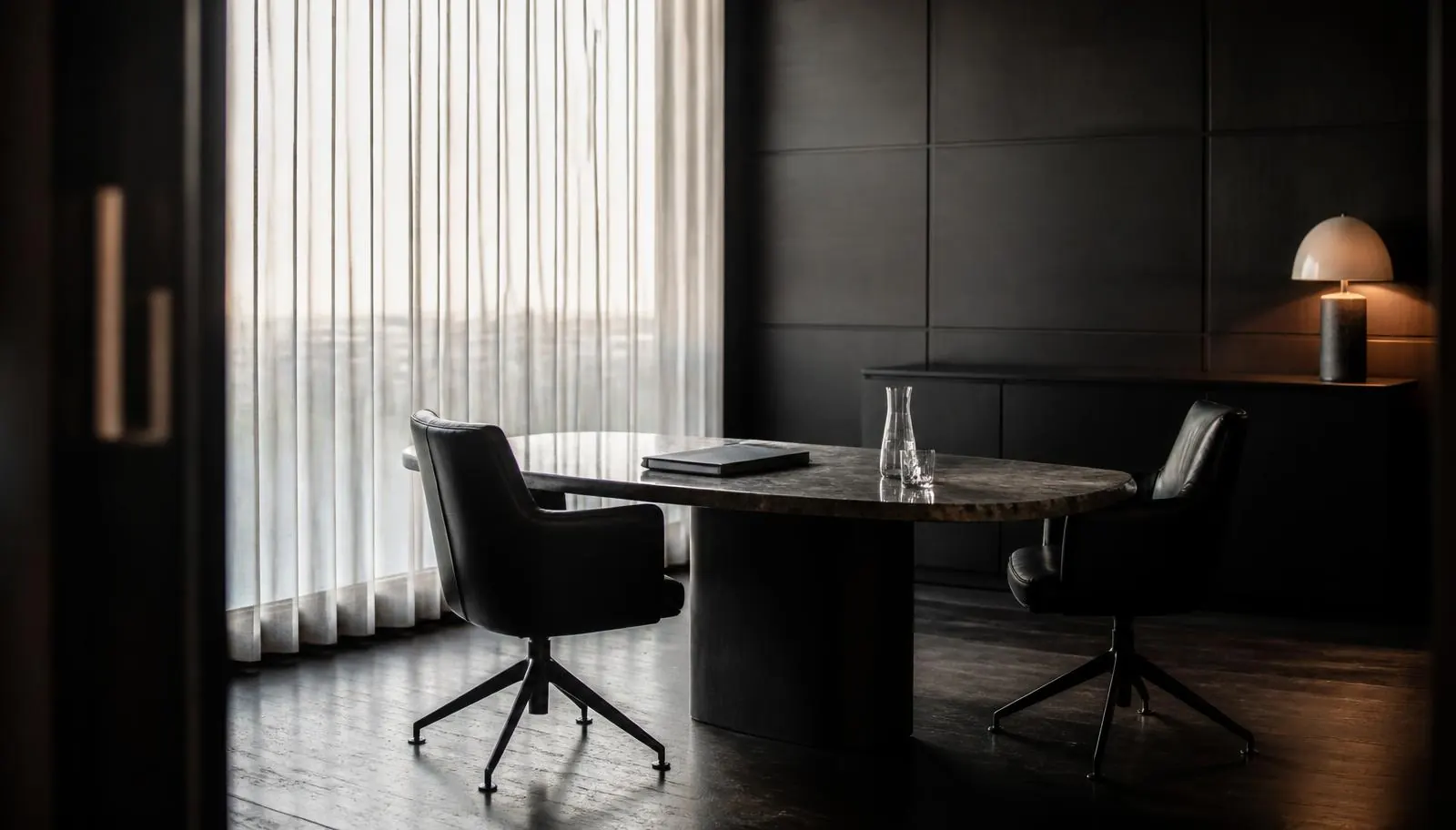 Private consultation office with leather chairs and a dark table set for a Colorado cannabis accounting meeting